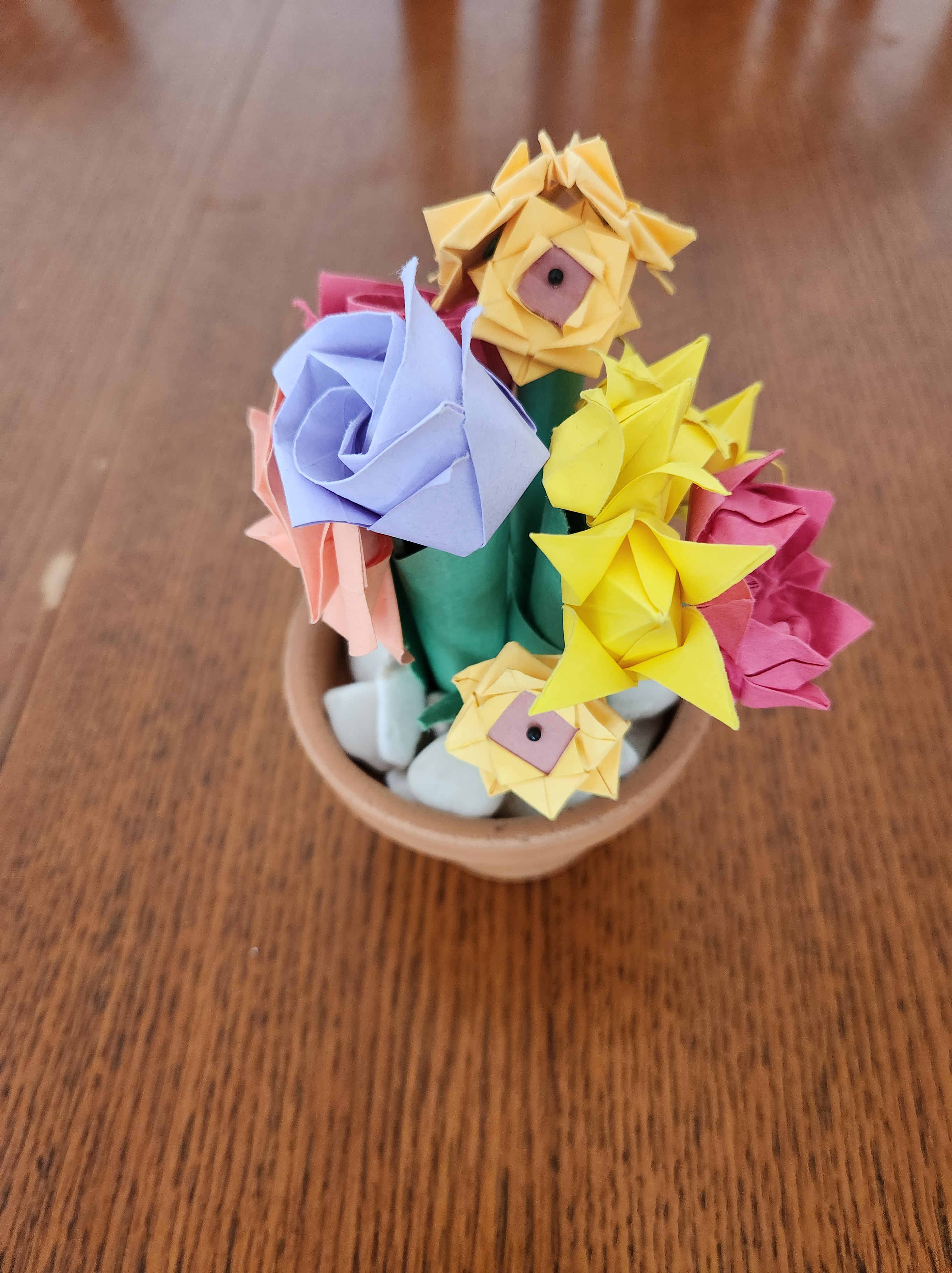 A pot with origami flowers